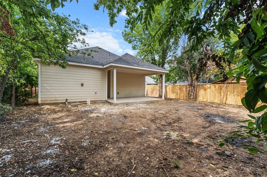 Back of property with a patio