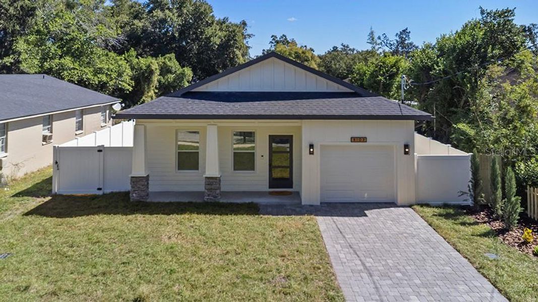 Front exterior of a new home in , Tampa, FL, highlighting curb appeal (Image 28).