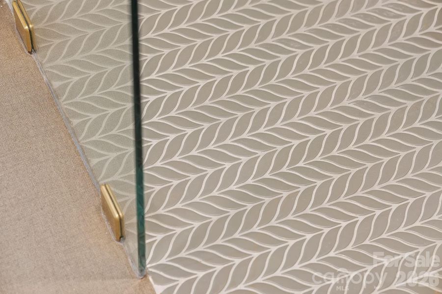 Custom Tiled Flooring in the Primary Shower Custom Tiled Flooring in the Primary Shower