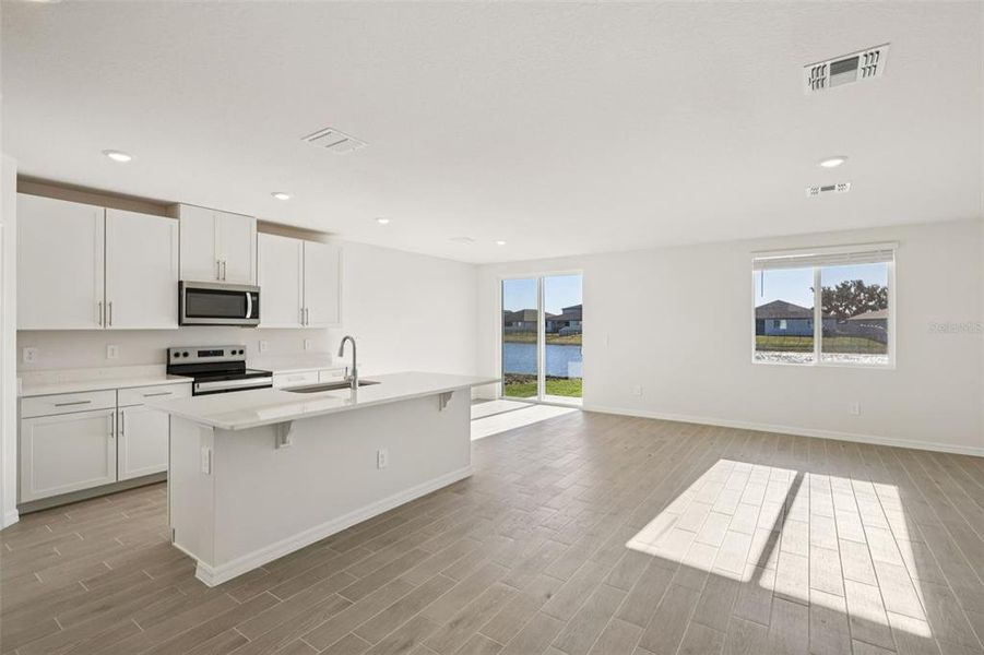 Furnished interior view inside a new home in The Grove at Stuart Crossing - Classic Series, Bartow (Image 11).