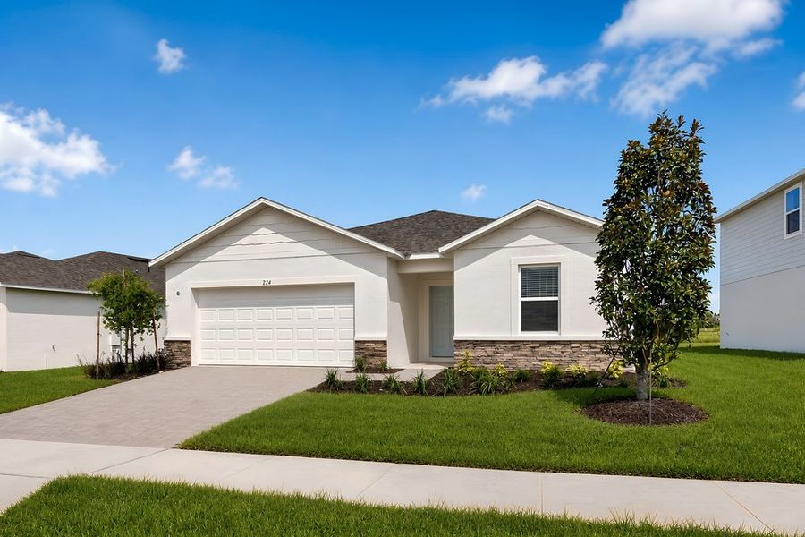 Front exterior of a new home in Waterstone, Groveland, FL, highlighting curb appeal (Image 21). Front exterior of a new home in Waterstone, Groveland, FL, highlighting curb appeal (Image 21).