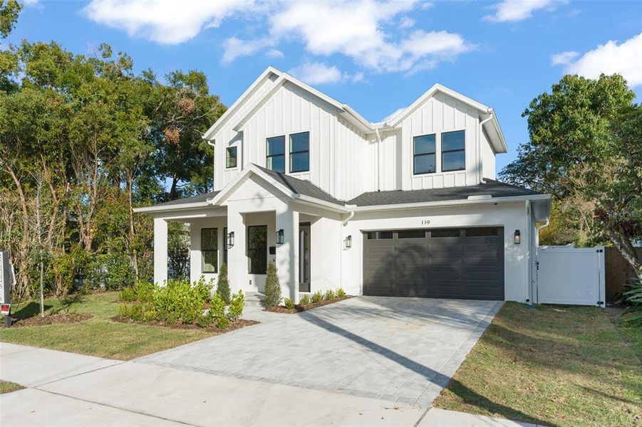 Front exterior of a new home in , Orlando, FL, highlighting curb appeal (Image 27). Front exterior of a new home in , Orlando, FL, highlighting curb appeal (Image 27).