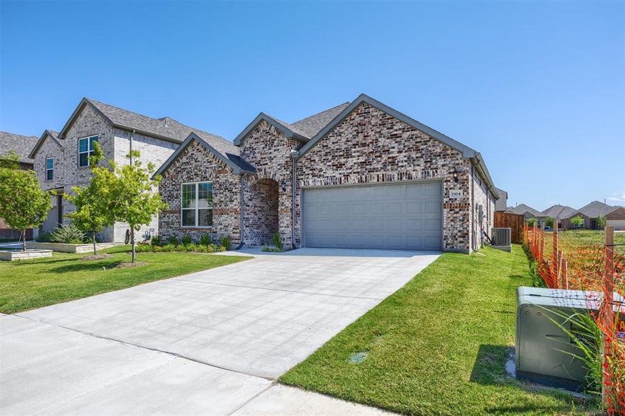 Front exterior of a new home in , Anna, TX, highlighting curb appeal (Image 21). Front exterior of a new home in , Anna, TX, highlighting curb appeal (Image 21).