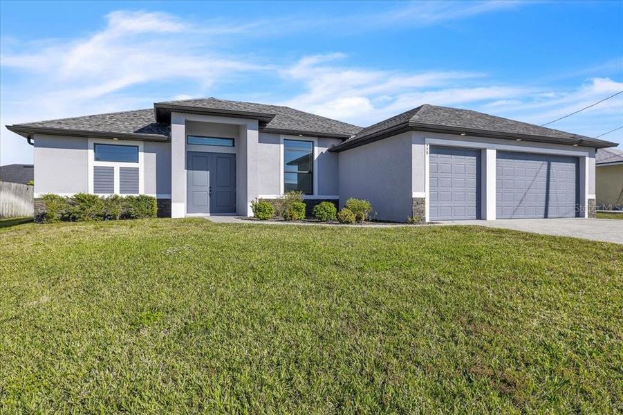 Front exterior of a new home in , Cape Coral, FL, highlighting curb appeal (Image 24).