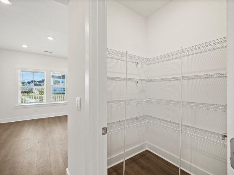 Spacious, unfurnished interior of a new home in The Coves at Lakes of Cane Bay, Summerville (Image 11).