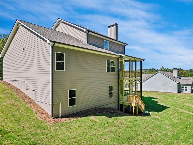 Exterior details and patio area of a home in Woodland Hills, Loganville (Image 2).