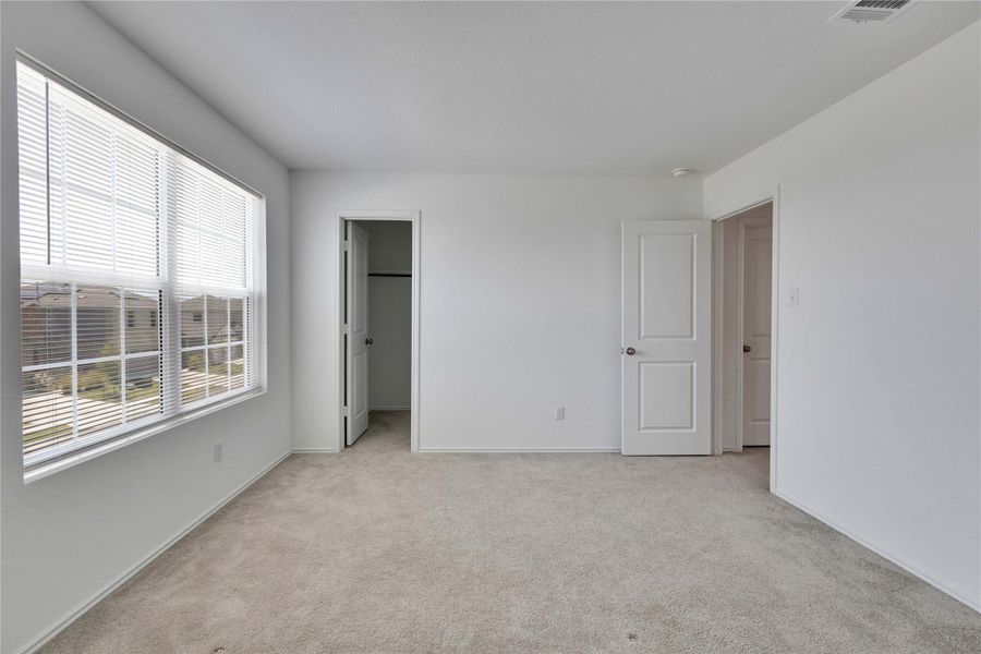 Upstairs bedroom with a walk in closet. Upstairs bedroom with a walk in closet.