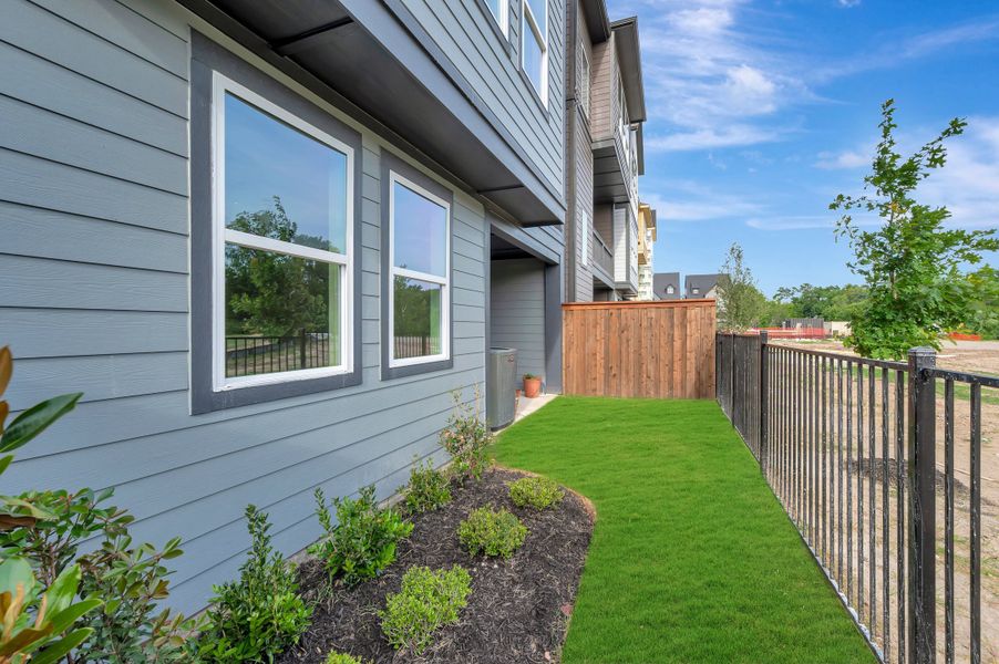 Exterior details and patio area of a home in Trails at Waterside - Villas Series, Fort Worth (Image 26).