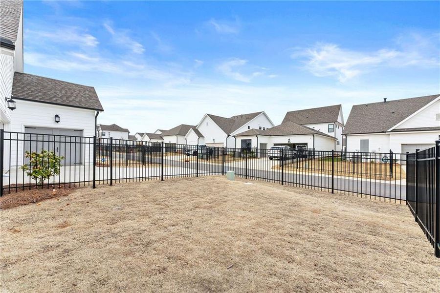 Exterior details and patio area of a home in Promenade at Sawnee Village, Cumming (Image 31).