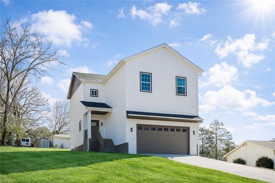 Front exterior of a new home in , Stockbridge, GA, highlighting curb appeal (Image 1). Front exterior of a new home in , Stockbridge, GA, highlighting curb appeal (Image 1).