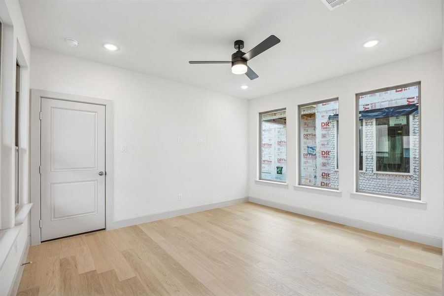 A wall of windows floods this family room with natural light creating a bright and inviting space.