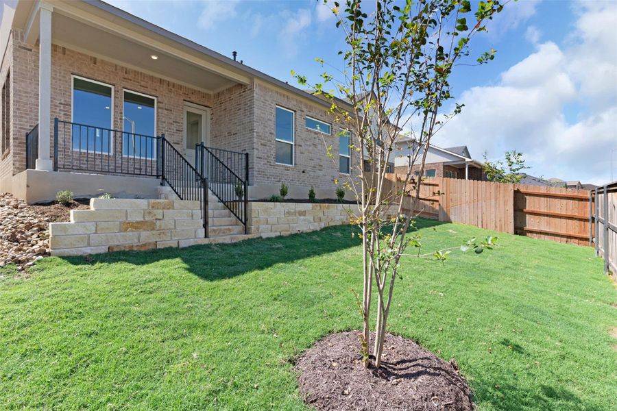 Back of house with brick siding