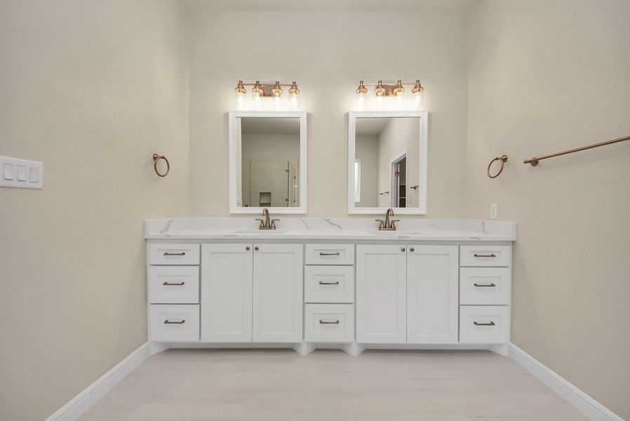 Take a look at the stylish fixtures. The neutral wall tones and ample lighting create a bright, clean atmosphere.