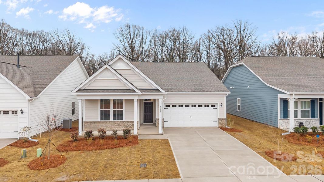Front exterior of a new home in Cottages at Wingate, Wingate, NC, highlighting curb appeal (Image 16).