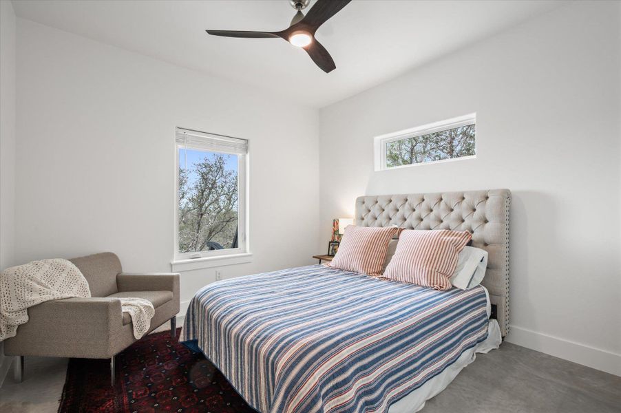 Secondary Bedroom overlooking the porch and hill country views