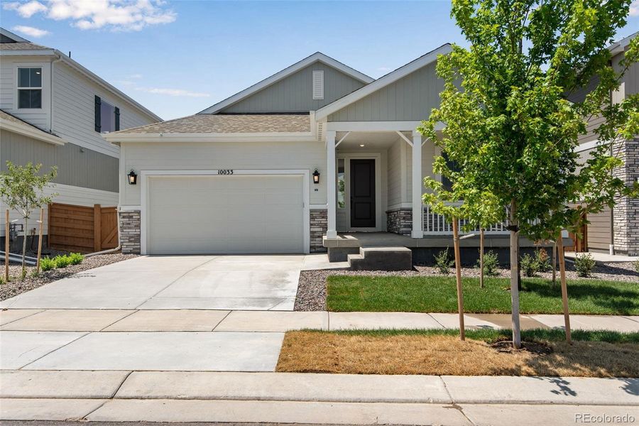 Front exterior of a new home in Reunion Ridge, Commerce City, CO, highlighting curb appeal (Image 25).