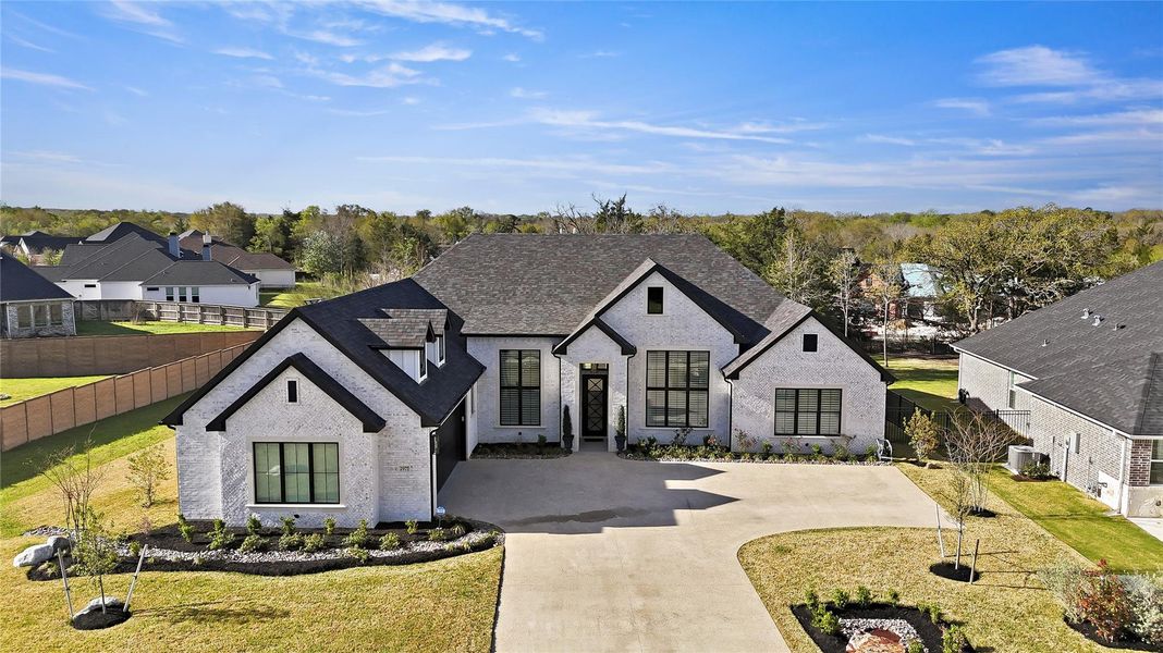 Front exterior of a new home in , Bryan, TX, highlighting curb appeal (Image 22).