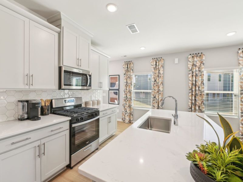 Kitchen in the Jade floorplan at a Meritage Homes community in Mebane, NC. Kitchen in the Jade floorplan at a Meritage Homes community in Mebane, NC.