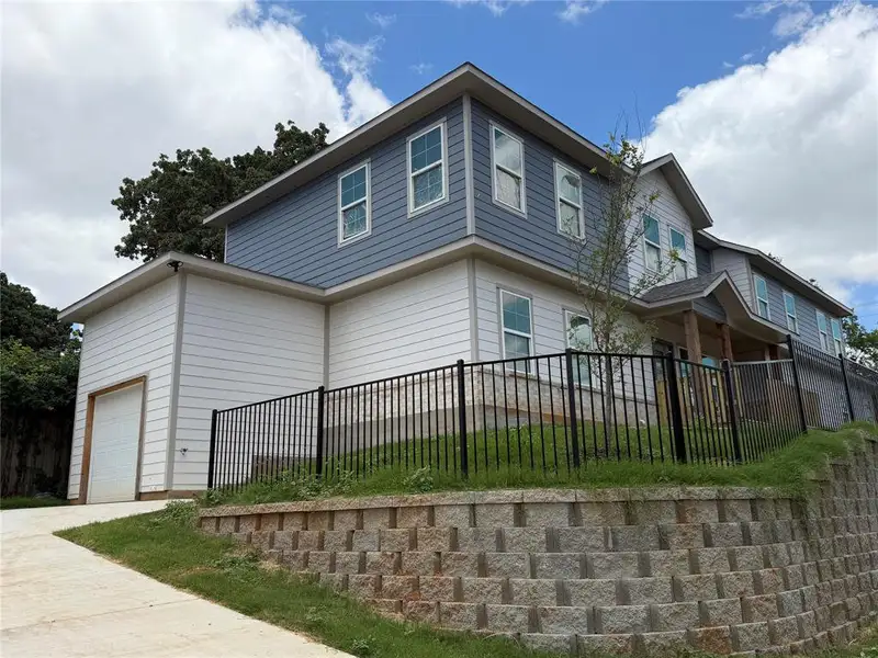 Front exterior of a new home in , Dallas, TX, highlighting curb appeal (Image 1). Front exterior of a new home in , Dallas, TX, highlighting curb appeal (Image 1).