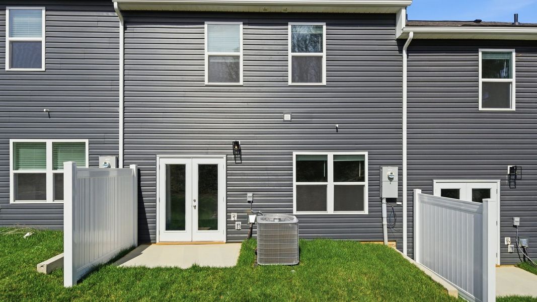Exterior details and patio area of a home in The Arbor Townhomes, Kingsport (Image 3).