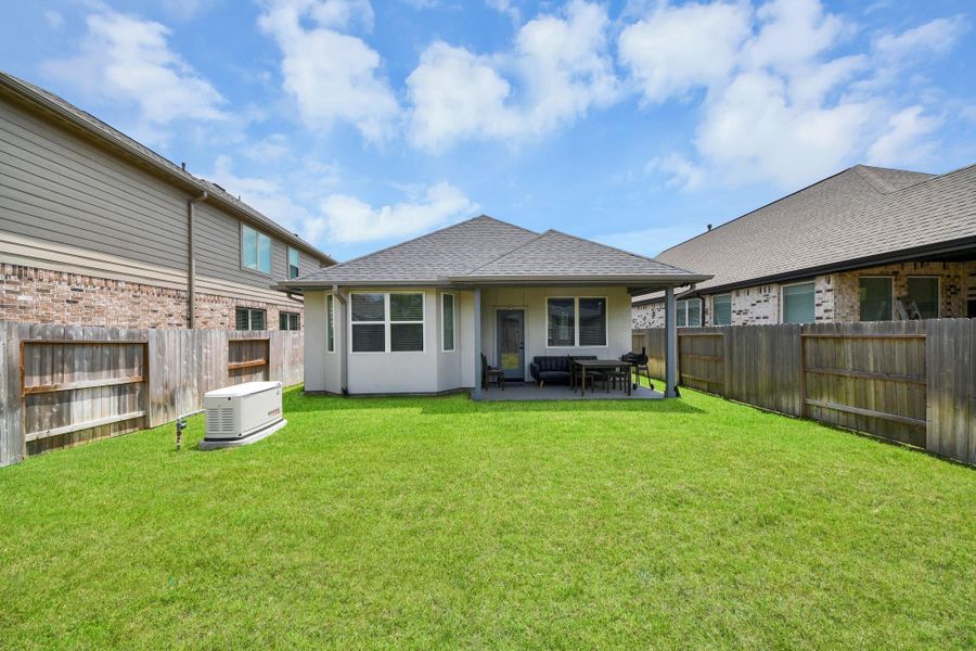 Exterior details and patio area of a home in , Conroe (Image 27).