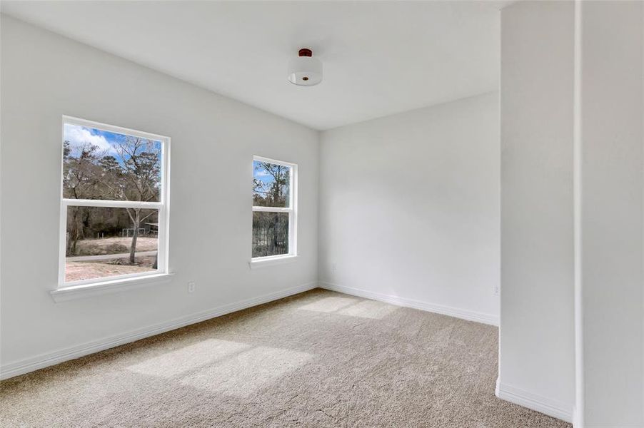 Spacious bedroom 2 with private en-suite bath.