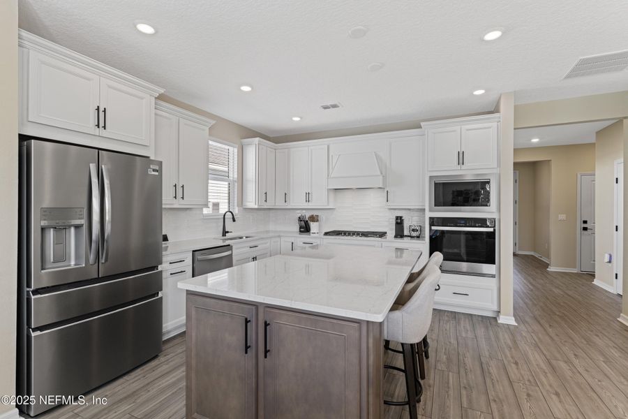 Furnished interior view inside a new home in Summer Bay at Grand Oaks, St. Augustine (Image 9).