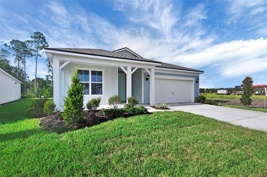 Front exterior of a new home in Seminole Palms, Palm Coast, FL, highlighting curb appeal (Image 21).