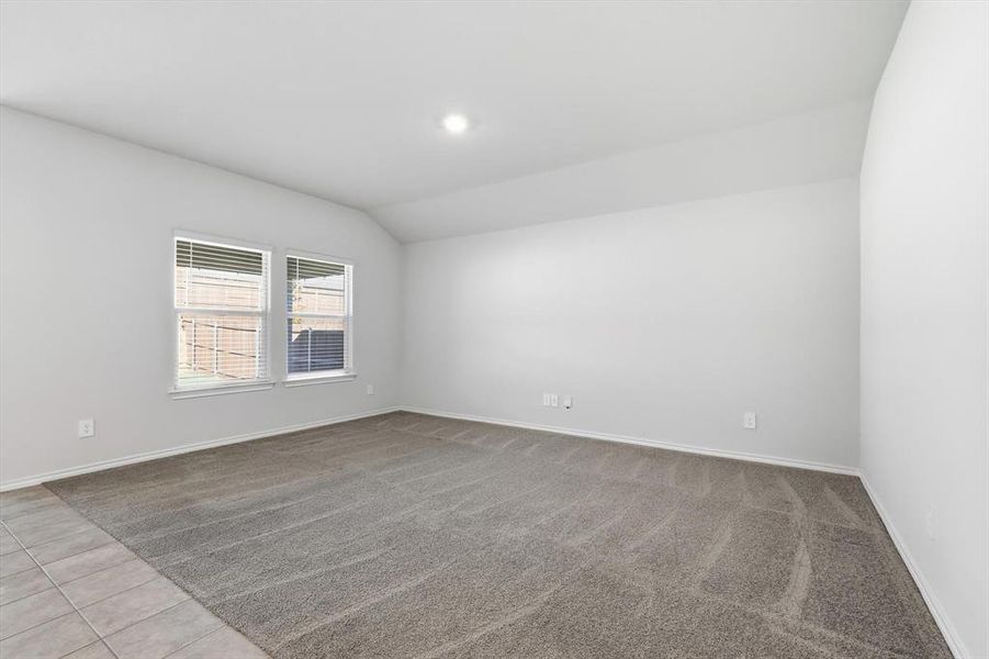 Living area with carpet, windows at back, recessed lightling Living area with carpet, windows at back, recessed lightling