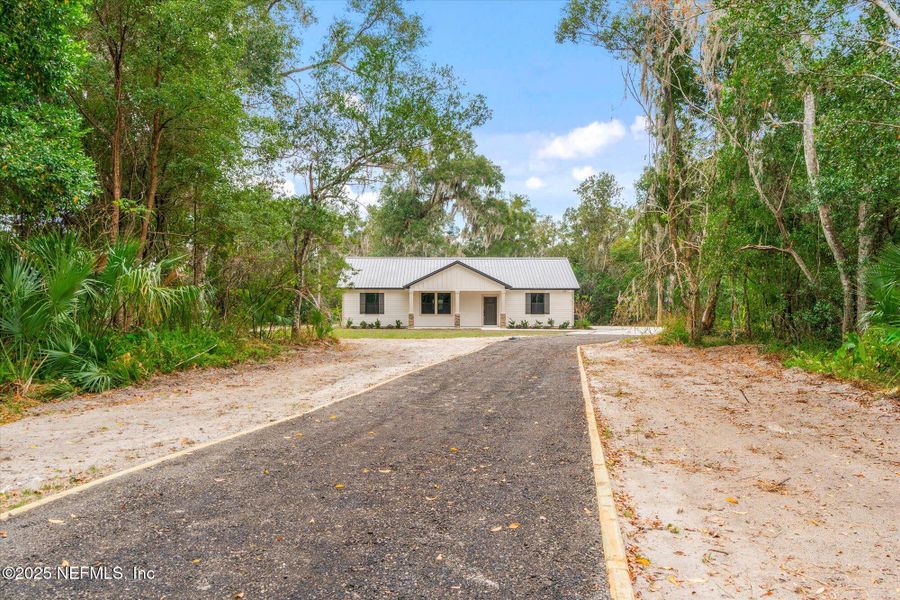 Front exterior of a new home in , San Mateo, FL, highlighting curb appeal (Image 33). Front exterior of a new home in , San Mateo, FL, highlighting curb appeal (Image 33).