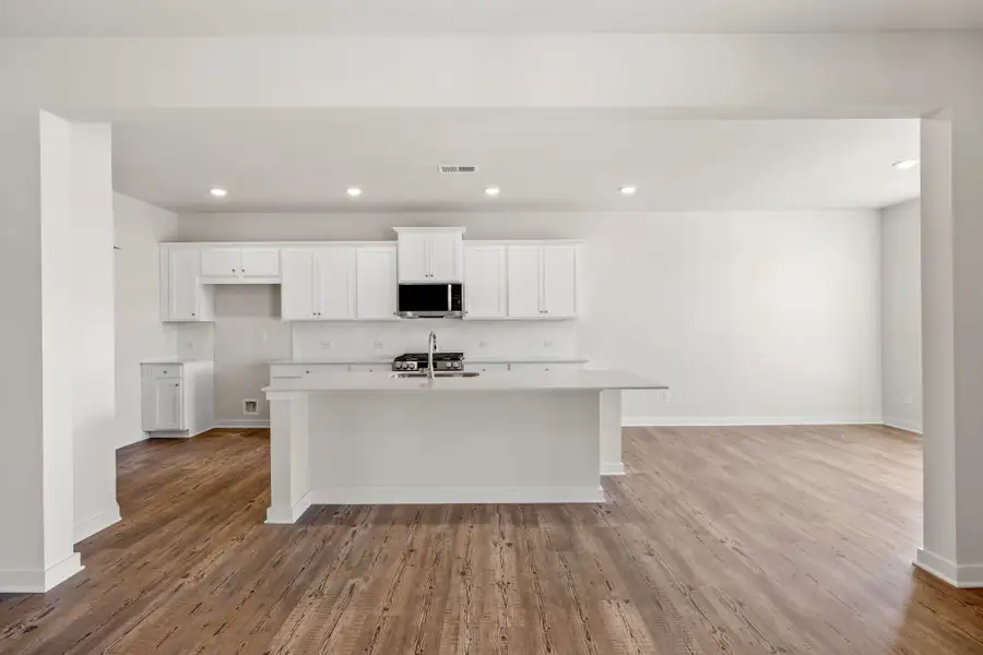 A kitchen with white cabinets. A kitchen with white cabinets.