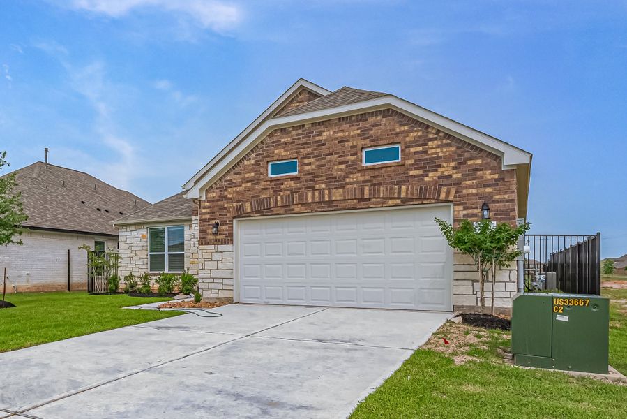 Representative exterior photo of a completed home built from the Floor Plan 2620 by Colina Homes in Woodland Lakes, Huffman, TX (Image 25). Representative exterior photo of a completed home built from the Floor Plan 2620 by Colina Homes in Woodland Lakes, Huffman, TX (Image 25).