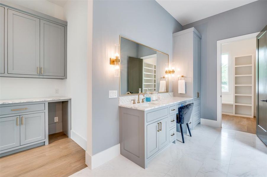 Bathroom featuring vanity and wood-type flooring