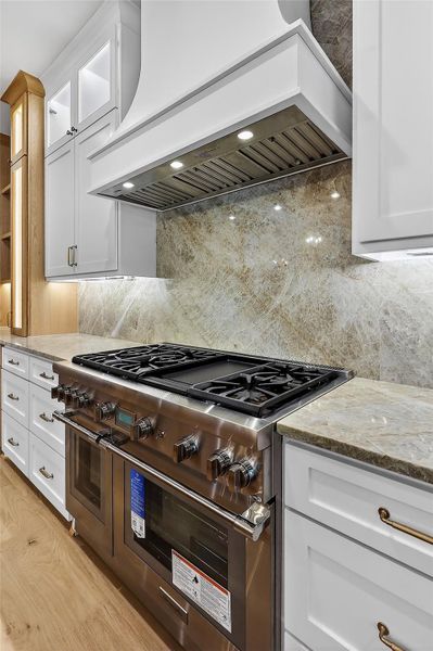 High-end appliances are seamlessly integrated for a clean, modern aesthetic.