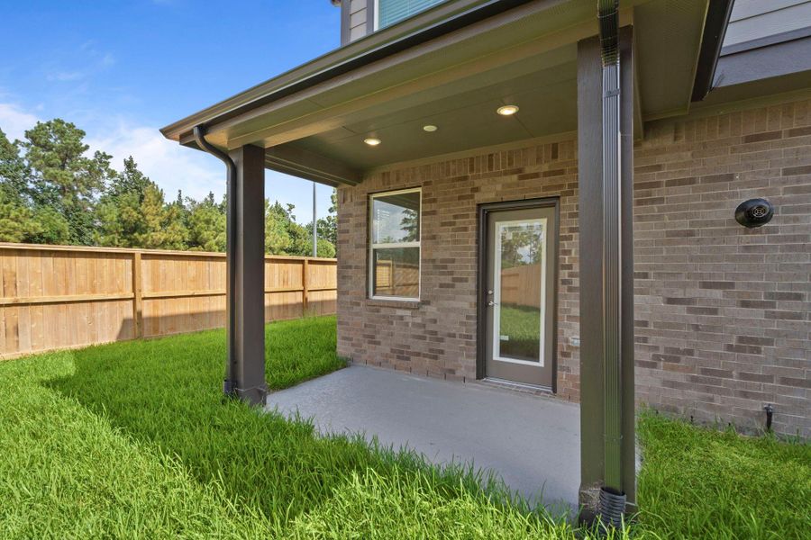 Exterior details and patio area of a home in Balmoral, Humble (Image 23).