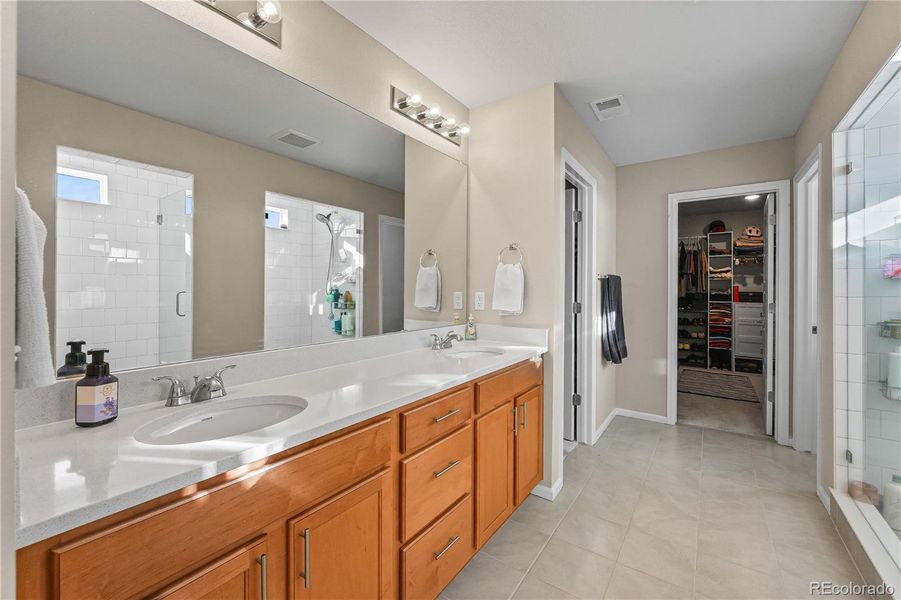 Primary Bathroom with two Primary closet: Dual vanities and spacious layout.
