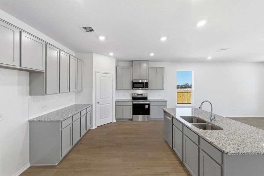 Furnished interior view inside a new home in Mustang Valley, Manor (Image 4).