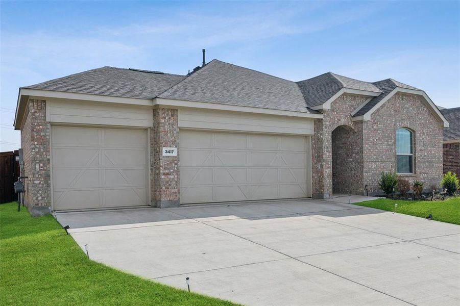 Front exterior of a new home in Linden Hills: Classic Collection, Little Elm, TX, highlighting curb appeal (Image 2). Front exterior of a new home in Linden Hills: Classic Collection, Little Elm, TX, highlighting curb appeal (Image 2).