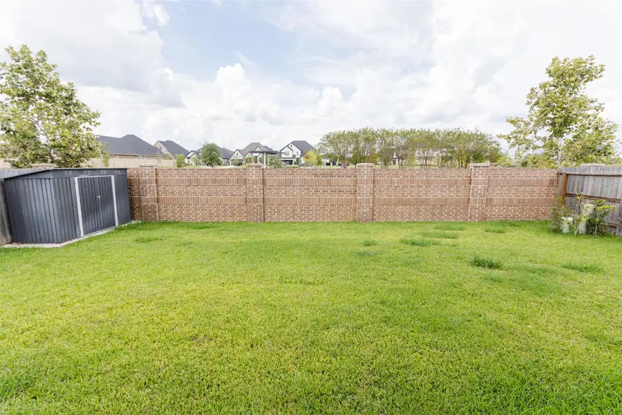 Exterior details and patio area of a home in , Tomball (Image 3).