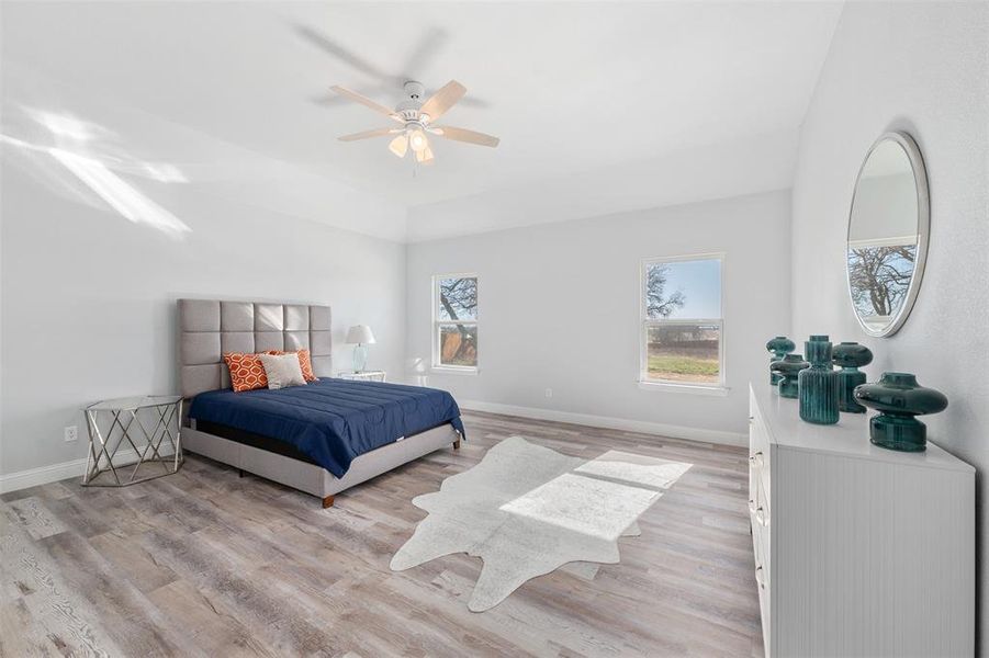 Bedroom featuring light hardwood / wood-style flooring and ceiling fan