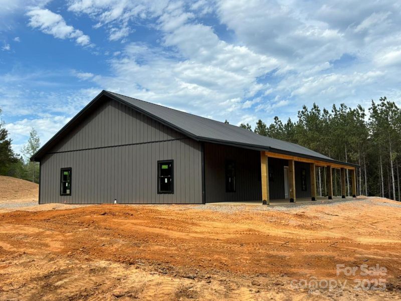 Front exterior of a new home in , Lenoir, NC, highlighting curb appeal (Image 1).