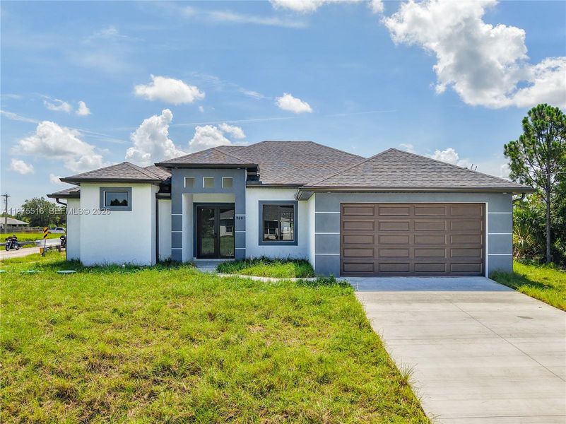 Front exterior of a new home in , Lehigh Acres, FL, highlighting curb appeal (Image 2). Front exterior of a new home in , Lehigh Acres, FL, highlighting curb appeal (Image 2).