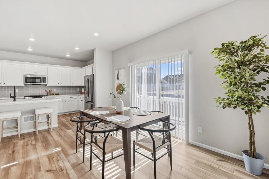 Furnished interior view inside a new home in Woodrose at Painted Prairie, Aurora (Image 5).