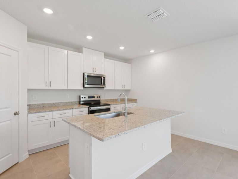 Furnished interior view inside a new home in Hilltop Vistas, Dade City (Image 7).