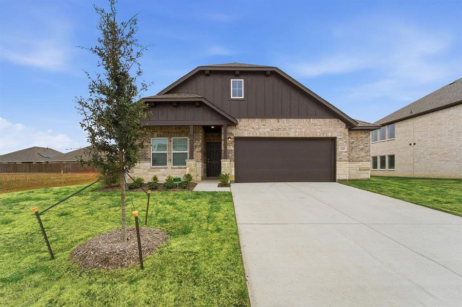 Front exterior of a new home in Saddlebrook Estates, Waxahachie, TX, highlighting curb appeal (Image 2).