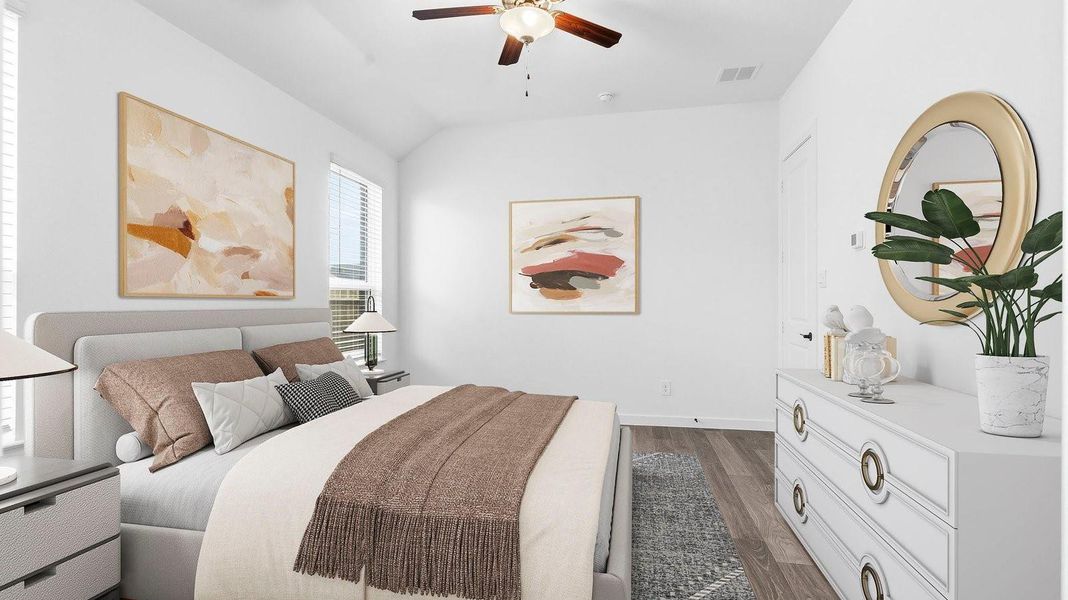 Primary bedroom with ceiling fan, plush carpeting, and a large walk-in closet. Primary bedroom with ceiling fan, plush carpeting, and a large walk-in closet.
