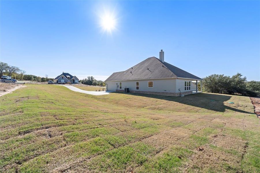 Exterior details and patio area of a home in Oak Grove Addition, Springtown (Image 28).