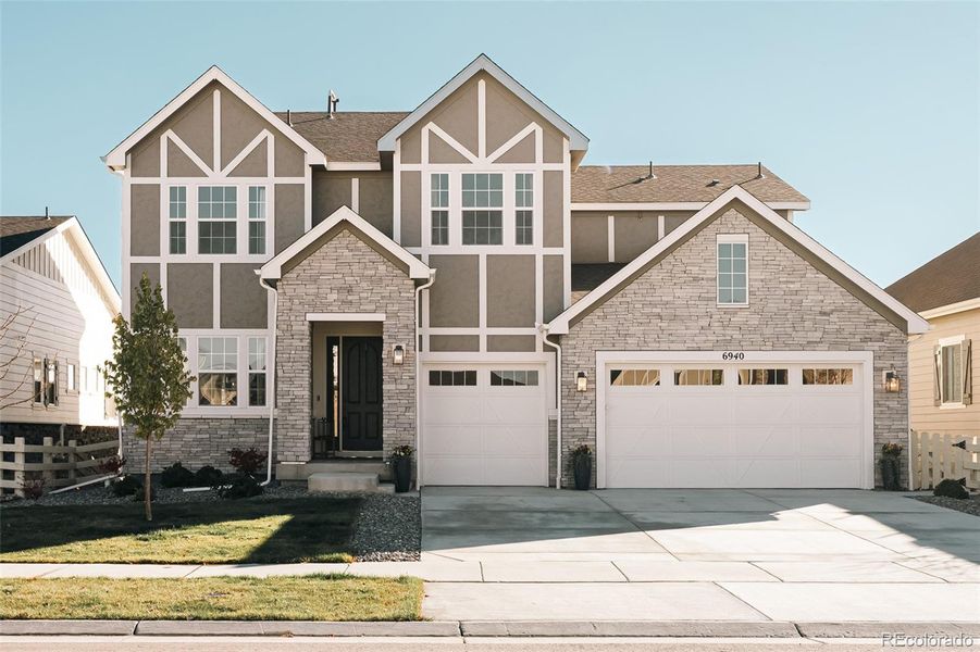 Front exterior of a new home in , Aurora, CO, highlighting curb appeal (Image 1). Front exterior of a new home in , Aurora, CO, highlighting curb appeal (Image 1).
