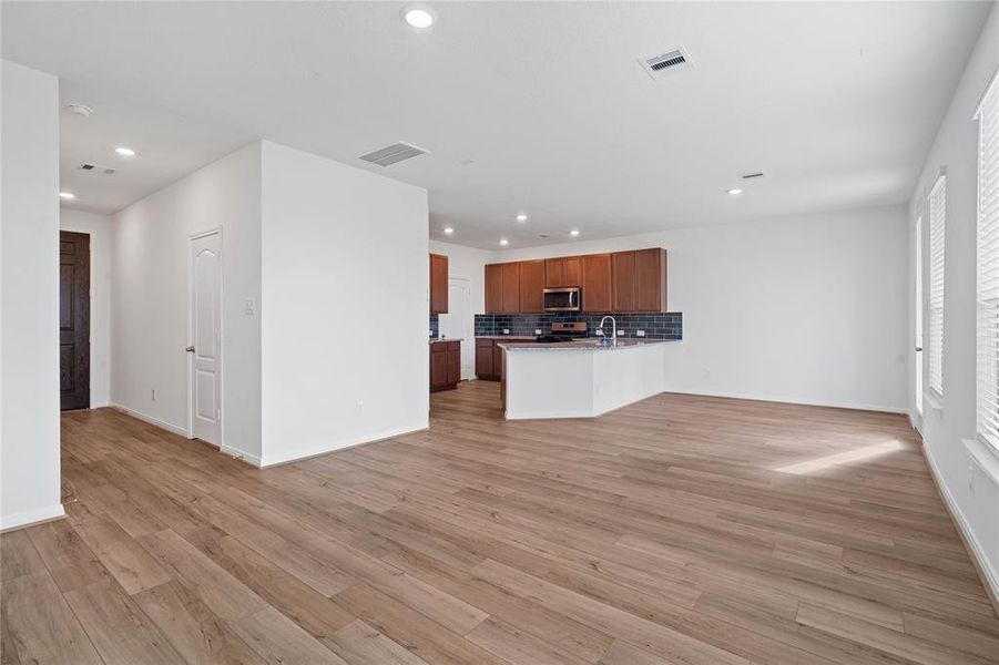 Another gorgeous view from the Family Room looking into the kitchen and dining areas.