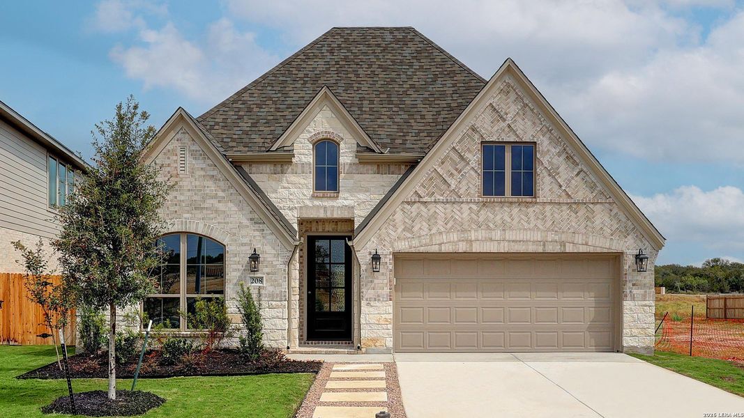 Front exterior of a new home in Alsatian Oaks, Castroville, TX, highlighting curb appeal (Image 2).